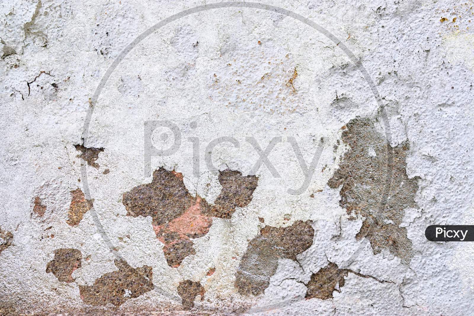 Close Up View On White Aged Concrete Walls With Cracks And Lots Of Structure