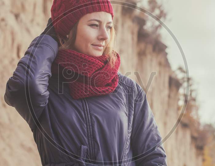 Woman In A Knitted  Cap  Walking
