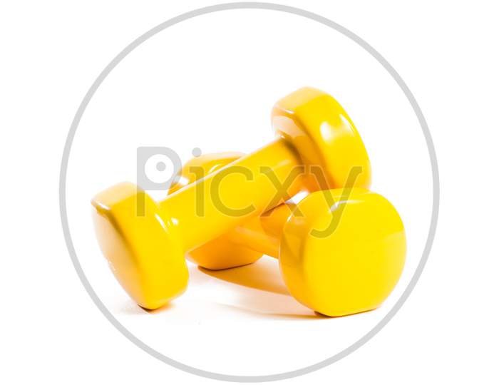 Two Yellow Dumbbells On An Isolated Background In A Random Order
