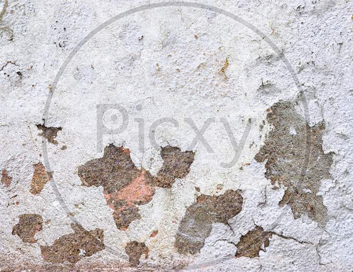 Close Up View On White Aged Concrete Walls With Cracks And Lots Of Structure