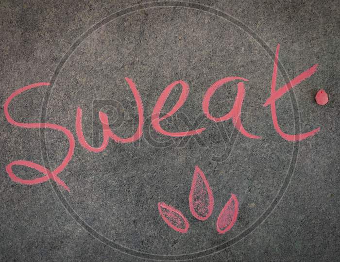 The Inscription Text On The Grey Board, Sweat With Hand Drawn Droplets. Using Color Chalk Pieces.Summer Concept
