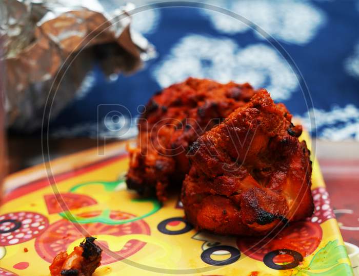 Close Up Image Of A Piece Of Fried And Roasted Chicken Tandoori Breast Piece.Its A Spicy North Indian Starter Dish