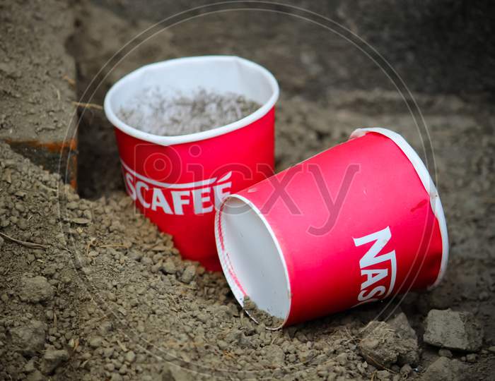 Nescafe wasted cup in soil