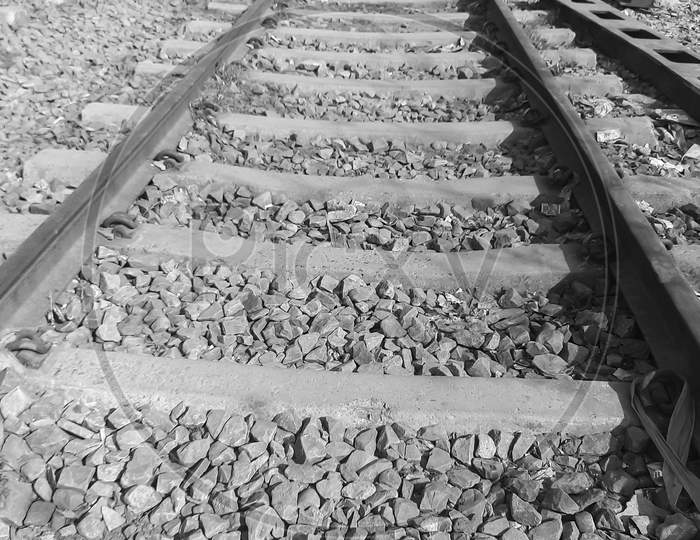 View Of Railway Tracks From The Middle During Day Time In Delhi India, Indian Railways Track View, Indian Railway Junction. Heavy Industry – Black And White