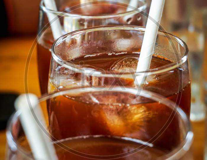 glass of special ice tea on wooden table