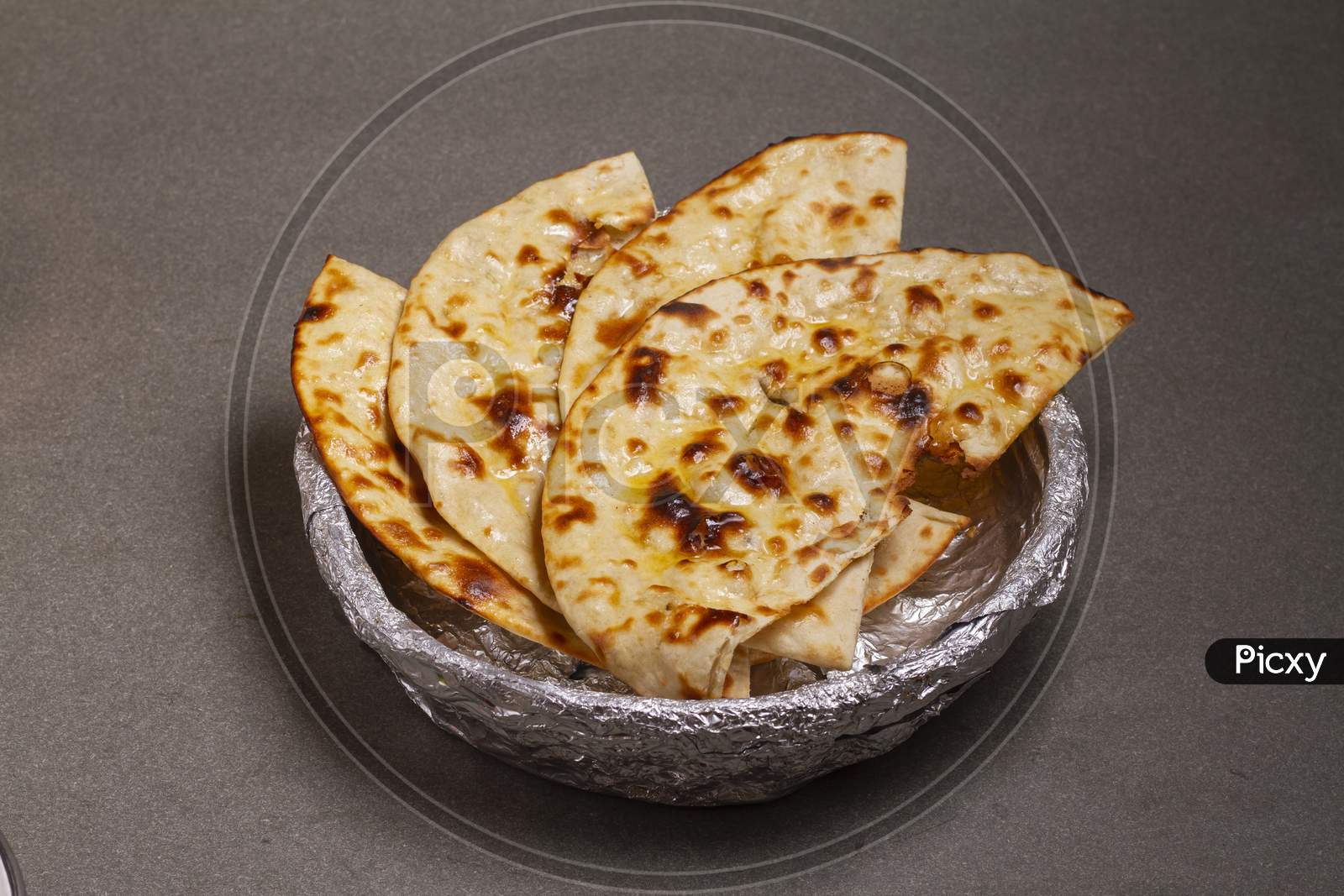 Indian Cuisine Tandoori Roti Also Served In Basket Including Chapati, Flatbread, Naan Or Nan Bread On Wooden Background