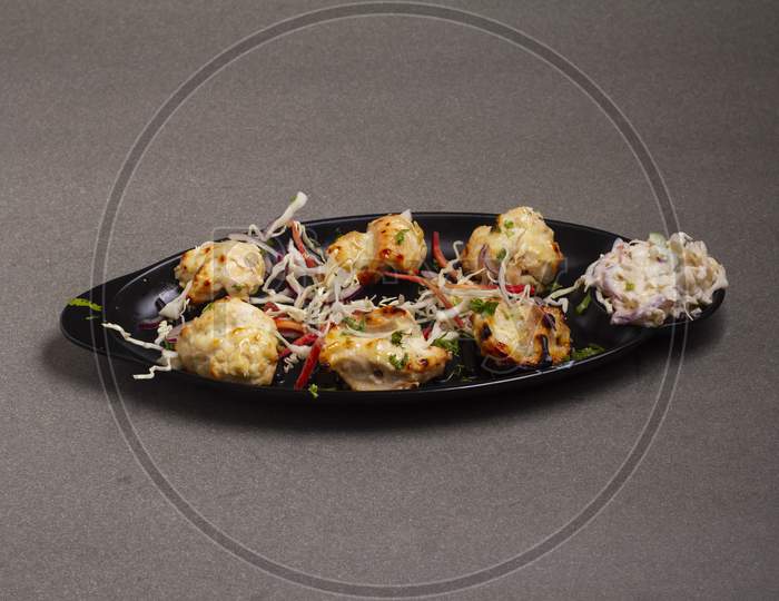 Chicken Malai Kebab.Traditional Indian Dish, Cooked On Charcoal And Flame, Seasoned