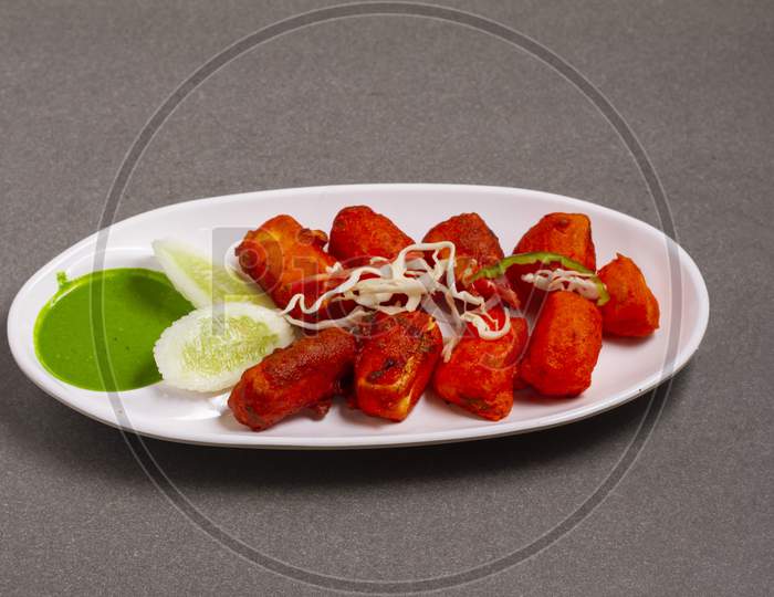 Paneer Tikka Kabab In Red Sauce - Is An Indian Dish Made From Pieces Of Cottage Cheese Marinated In Spices