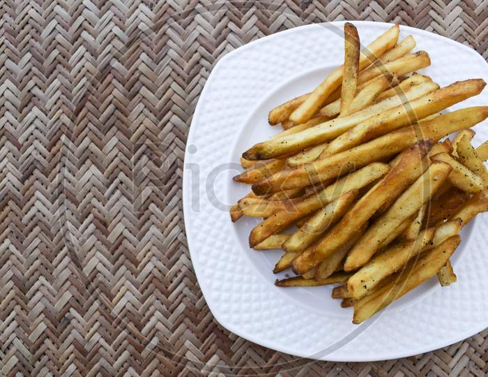 Crispy Crunchy French Fries Heap. Potato Finger Chips With Seasoning Masala. Very Tasty Popular Teatime Snack Item Worldwide Eaten. Potato Deep Fried Snacks