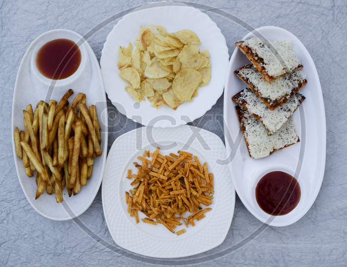 Indian Fasting Upwas Items Eaten During Fesivals As Religious Belief. Snacks Like Potato Chips, Tikha Chivda, French Fries, Farali Pizza With Jain Sauce.Breakfast Lunch Platter Mahashivratri