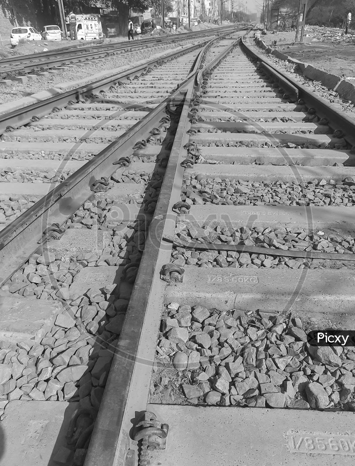 View Of Railway Tracks From The Middle During Day Time In Delhi India, Indian Railways Track View, Indian Railway Junction. Heavy Industry – Black And White