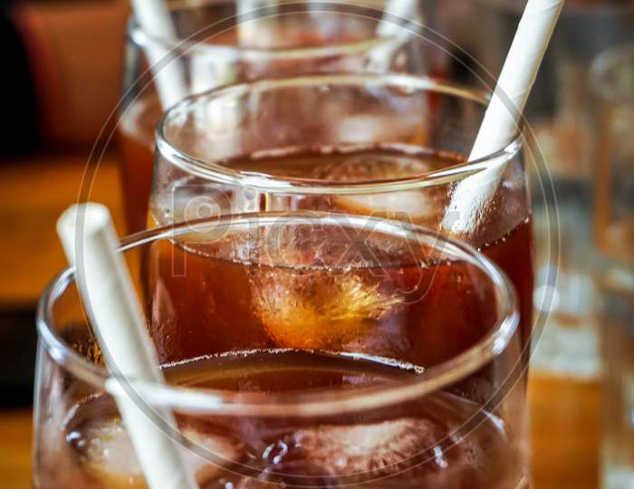 glass of special ice tea on wooden table