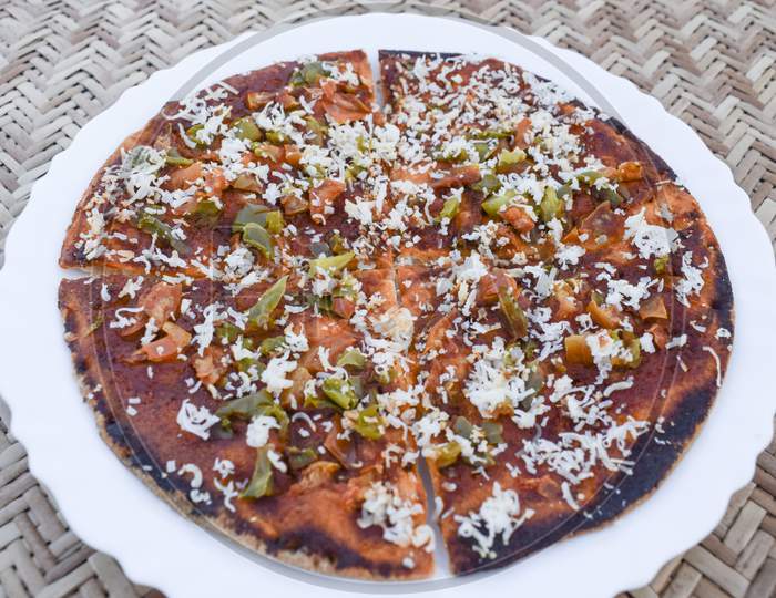 Farali Pizza Made Out Of Fasting Flour Eaten During Indian Fast With Fasting Ingredients Topped With Cheese. Indian Hard Based Pizza. Prepared During Ekadashi, Maha Shivratri, Puja.