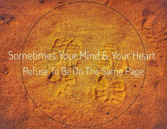 Sometimes Your Mind And Your Heart Refuse To Be On The Same Page. Inspirational Quote, Positive Saying, With Sand And Brown Background