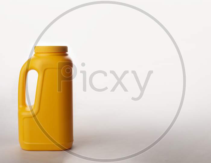 Yellow Plastic Can Isolated On White Background