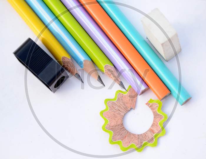 Bunch The Colorful Wooden Pencils With Black Sharpener And Eraser Waste Flower Isolated On White Background.