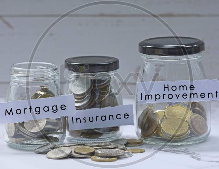Glass jars with multicurrency coins and text - Mortgage, Insurance, Home Improvement