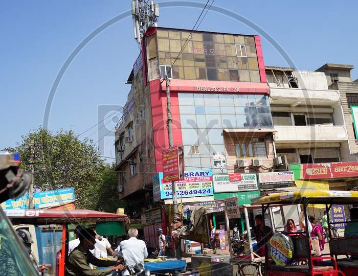 Street City Closeup With Auto Battery E Rickshaw. Busy Market And Routine Daily Life Closeup.