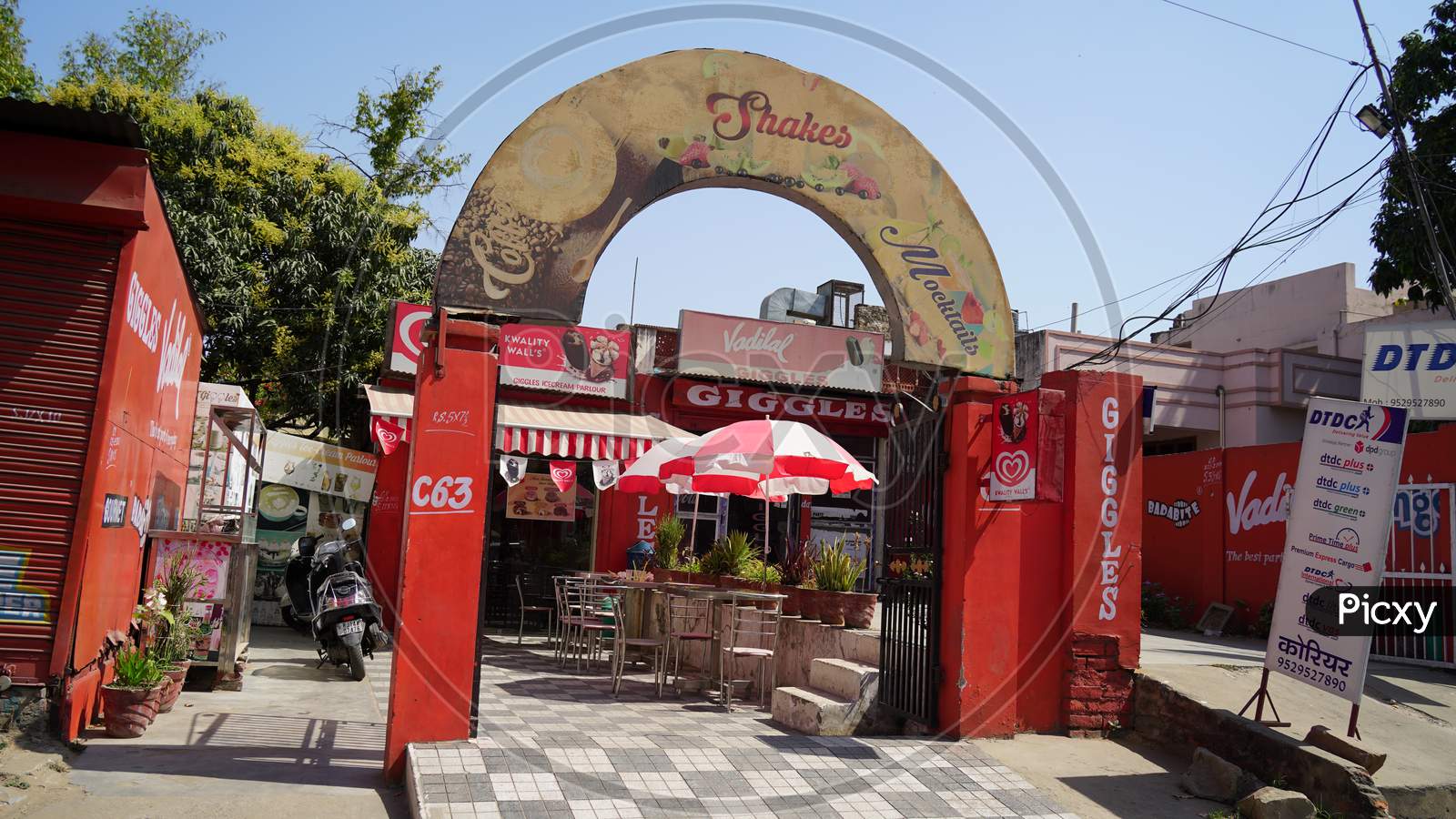 Enter Gate Of A Restaurant With Attractive Decorations. Outdoor Closeup Of A Fast Food Restaurant.