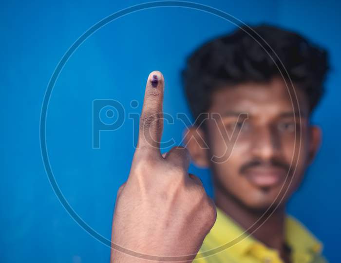 Chennai, India - 5Th March 2021: Indian Voter Showing His Hand With Voting Sign And Ink Pointing Vote For India.