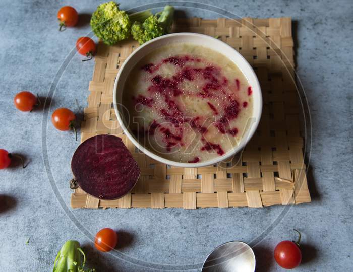 Healthy food ingredient chicken soup prepared with white oil and beetroot