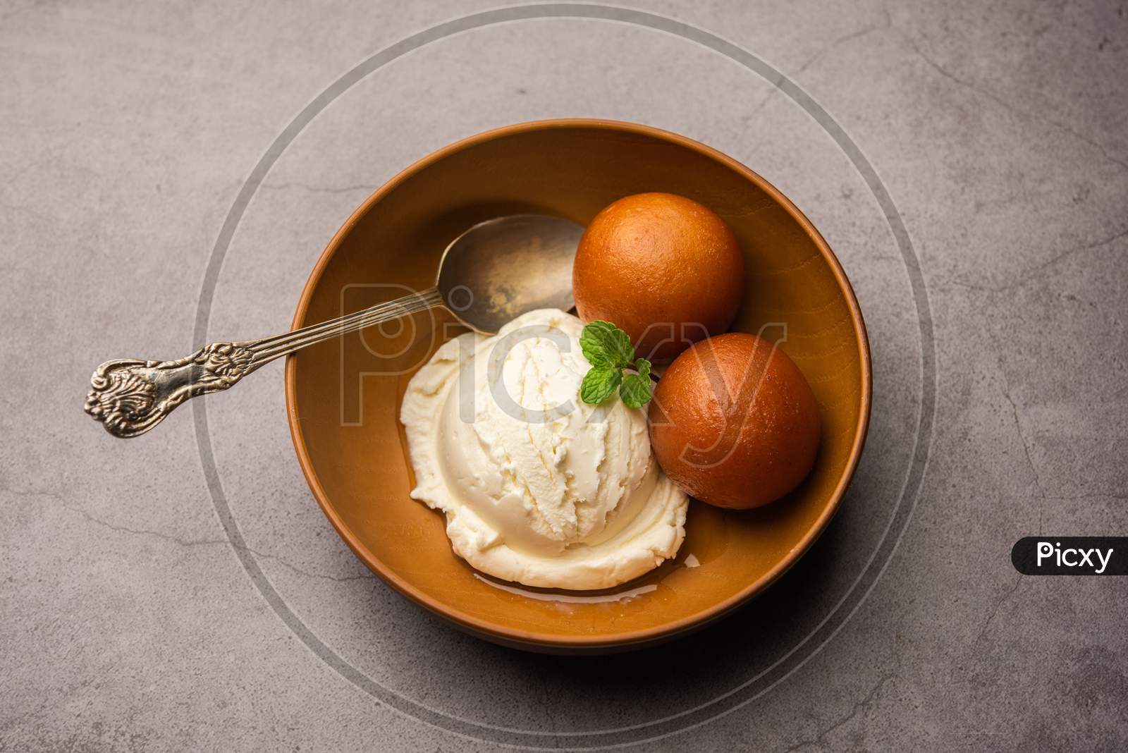 Gulab Jamun With Ice Cream Is An Indian Sweet Dish