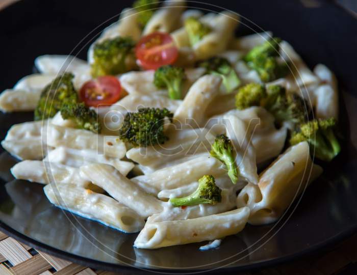 Popular dish penne cheese pasta with broccoli