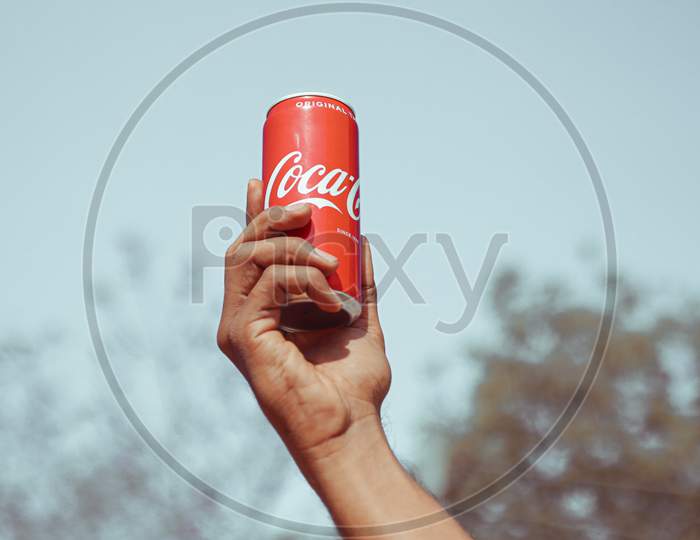 Coca-Cola hand