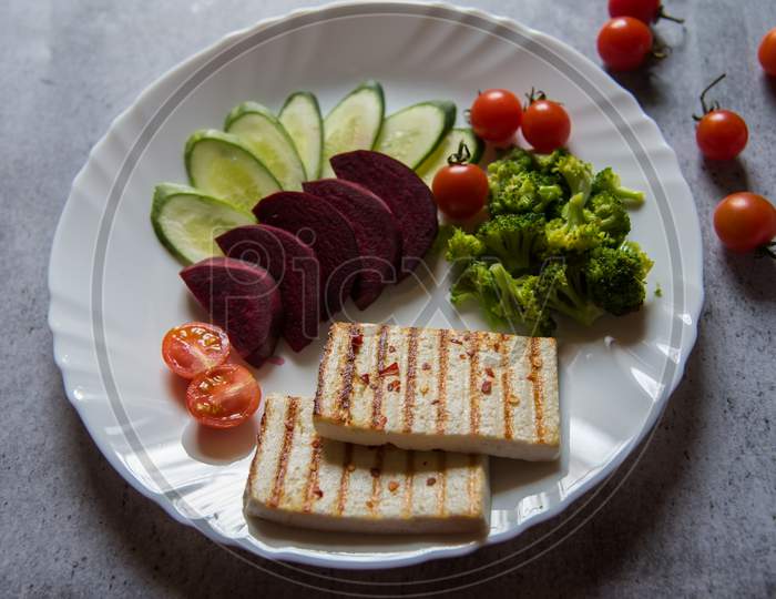 Top view of paneer or cottage cheese grilled steak with vegetables