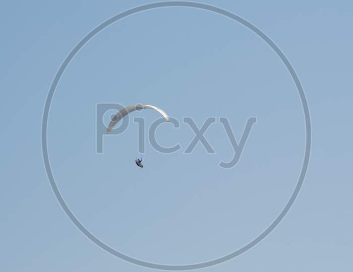 View On A Paraglider Flying In A Blue Sky In Switzerland