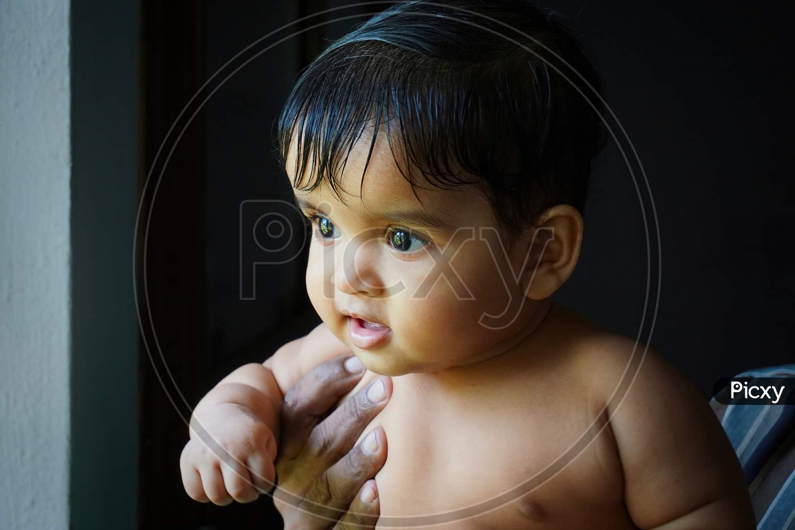 Image Of One Year Old Indian Baby Girl In The Hands Of Her Grandfather 