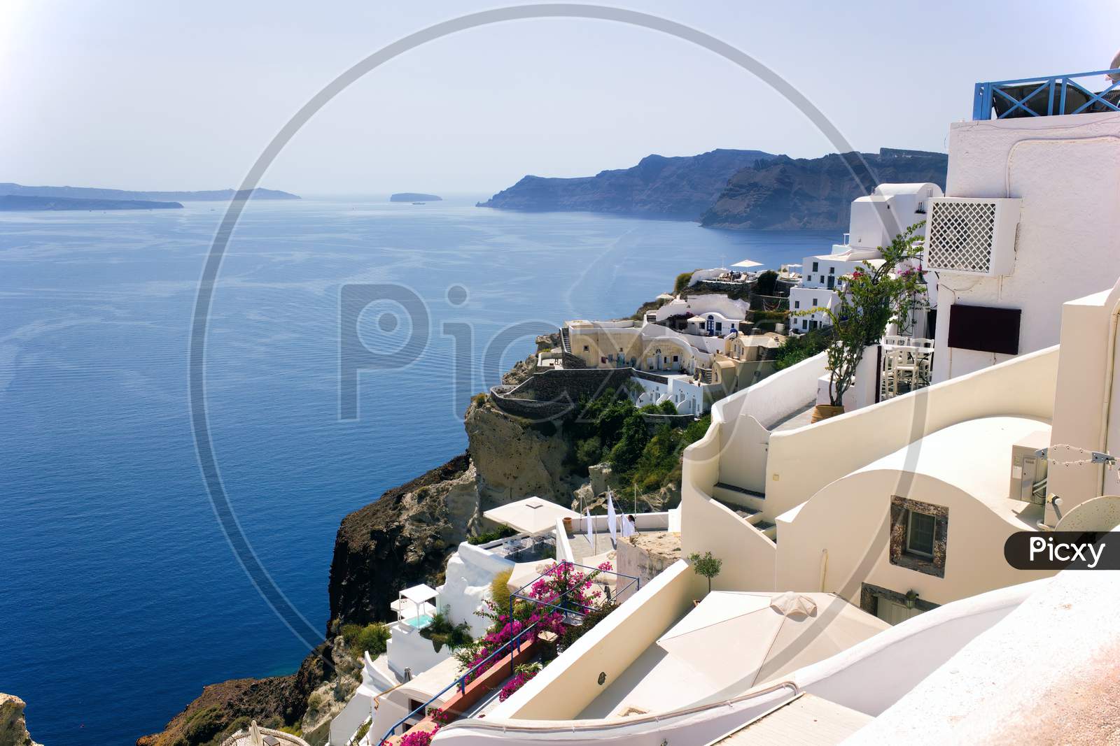 Cyclades Architecture Hotels Houses Over The Caldera In Oia Santorini Greek Islands, Greece, Mediterranean Sea View With Mountains