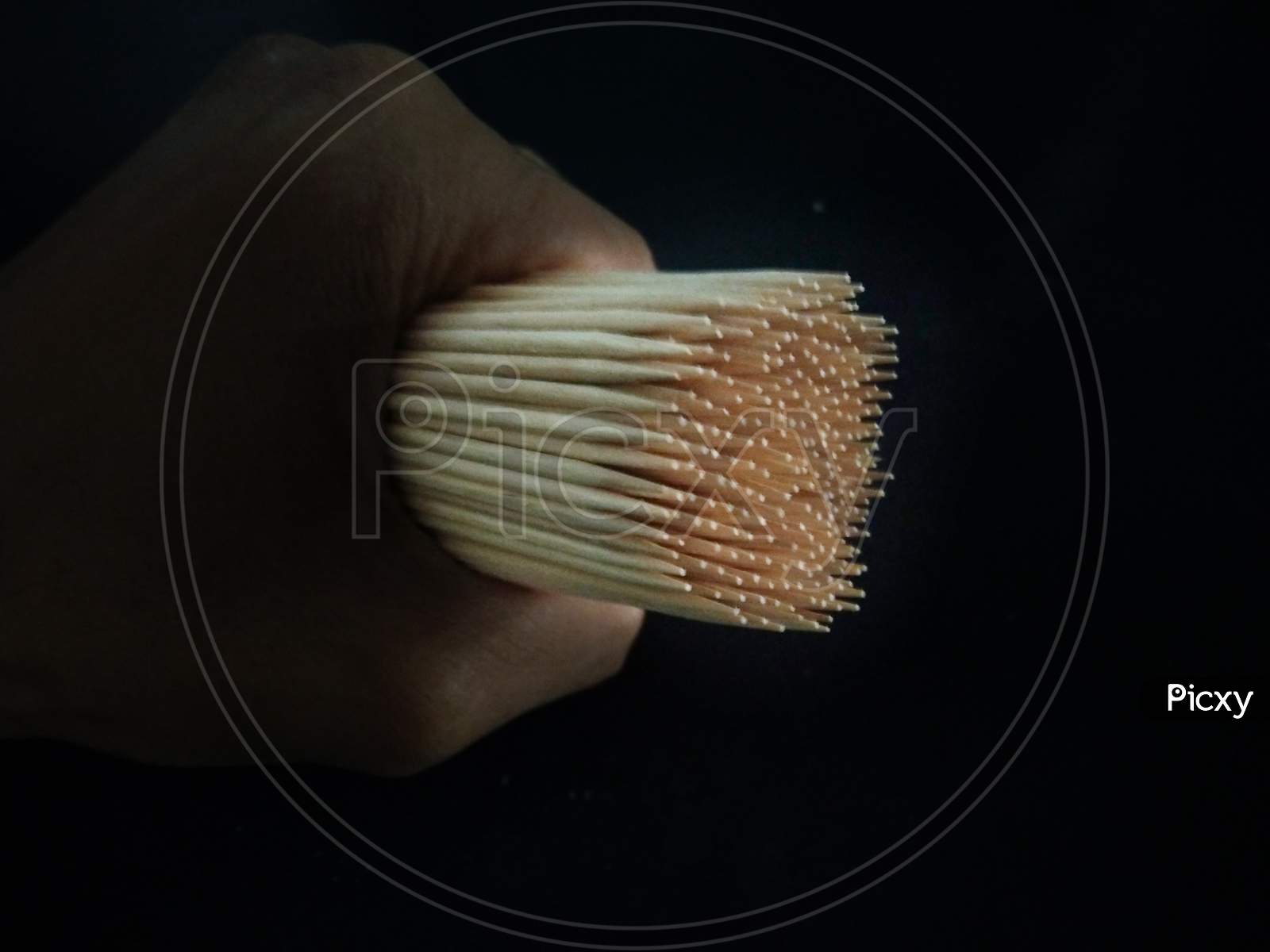 A close view of a fist of bamboo toothpick