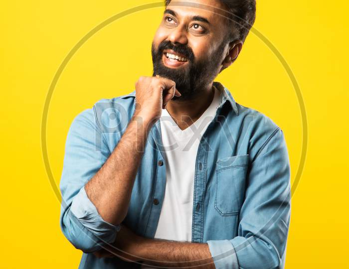 Portrait Of Bearded Indian Young Man With Arms Crossed