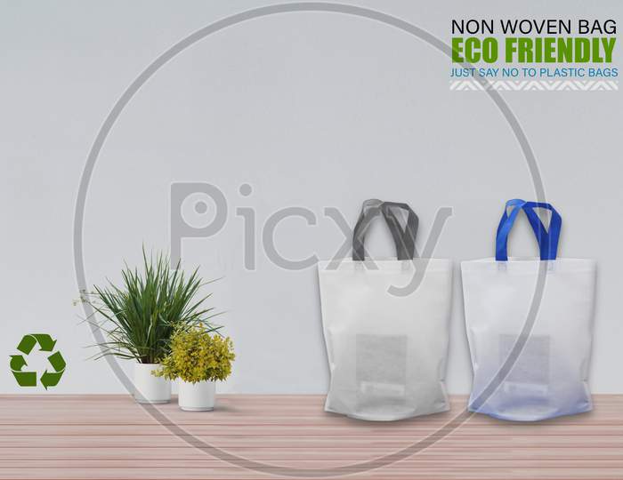 Empty Mockup Bags Isolated On Table With White Background. Eco Bags. Copy Space For Text.