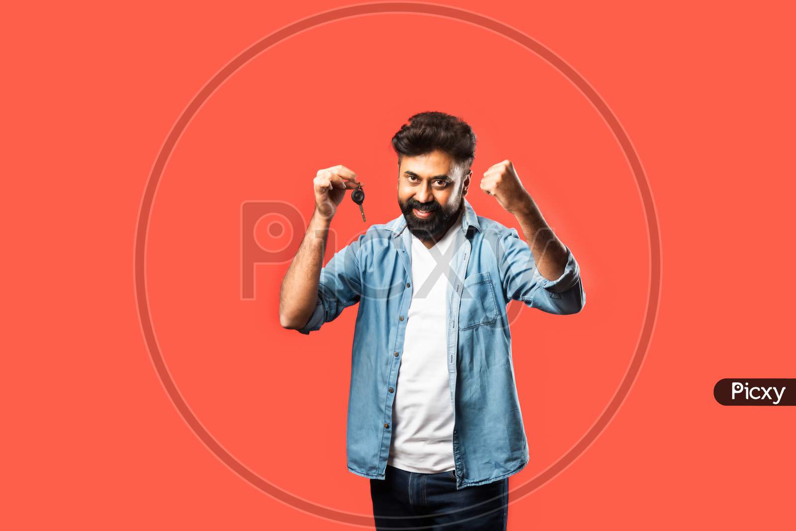 Bearded Man With Keys Standing Against Red Background, Selective Focus
