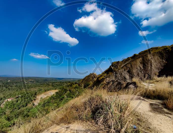 Amazing Landscape View With Greens Under The Blue Sky