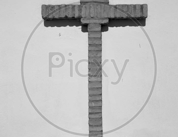 Christian Cross Of Bricks On A White Background