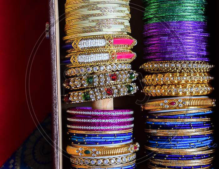Stock Photo Of Indian Traditional Colorful Bangles And Bracelet Kept And Decorated In Bangle Box On Red Background, Focus On Object At Bangalore Karnataka India.