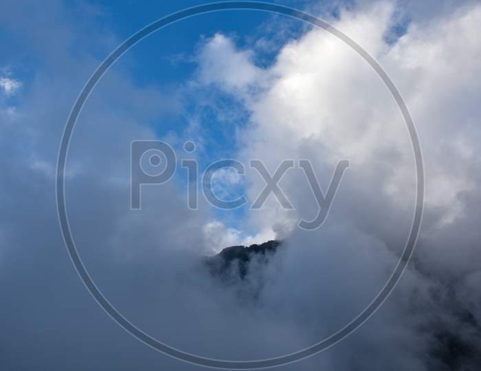 Majestic Mountain Ridge Silvery Cloud And Blue Sky