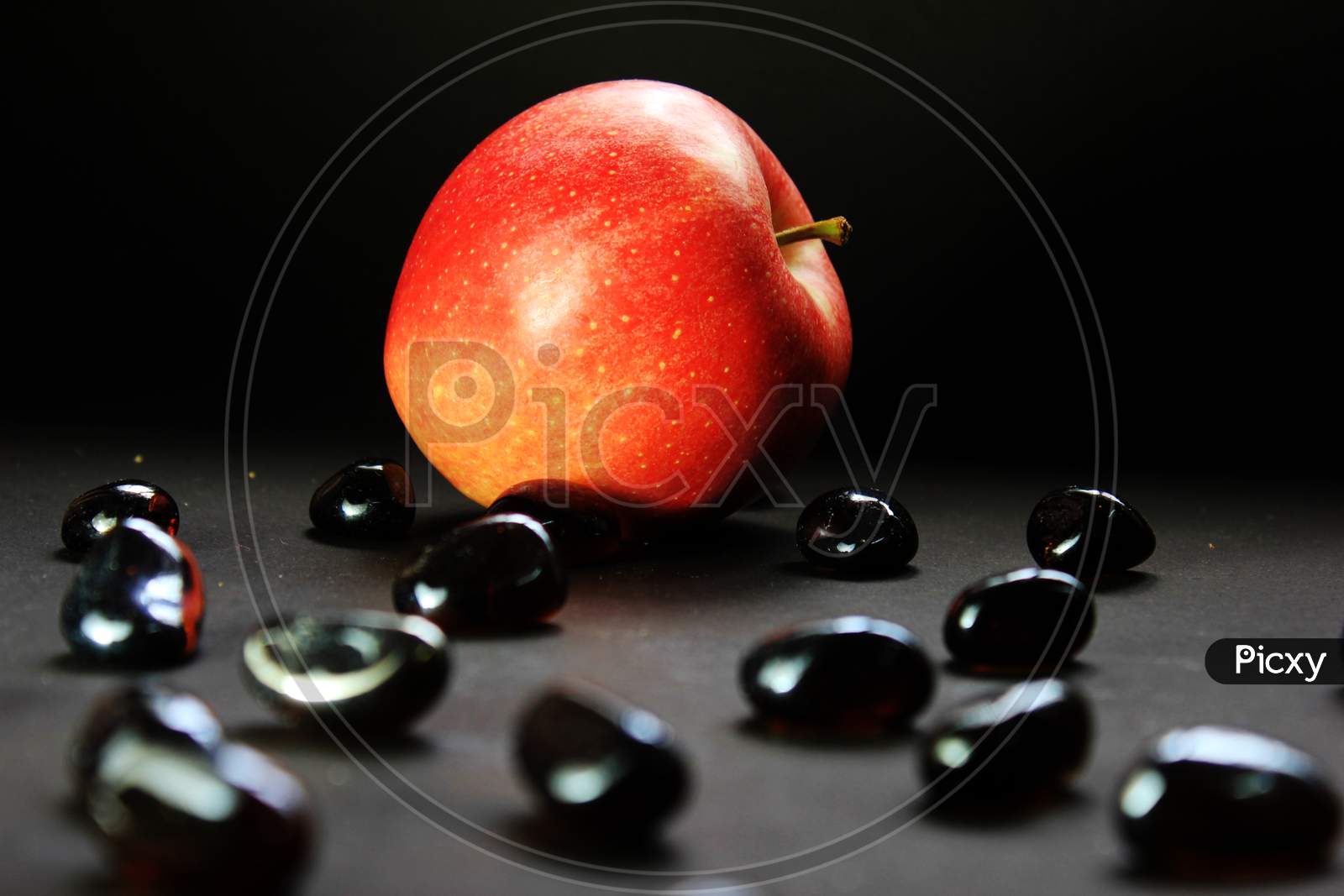 An Apple In A Dark Background