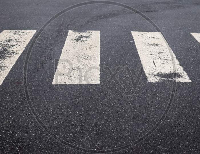 White Painted Pedestrian Zebra Crossing On A Road In Europe.