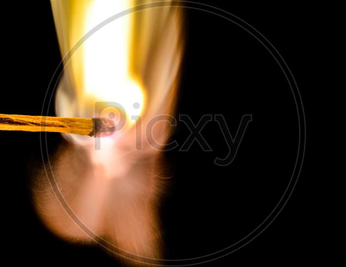 Closeup picture of fire on a matchstick