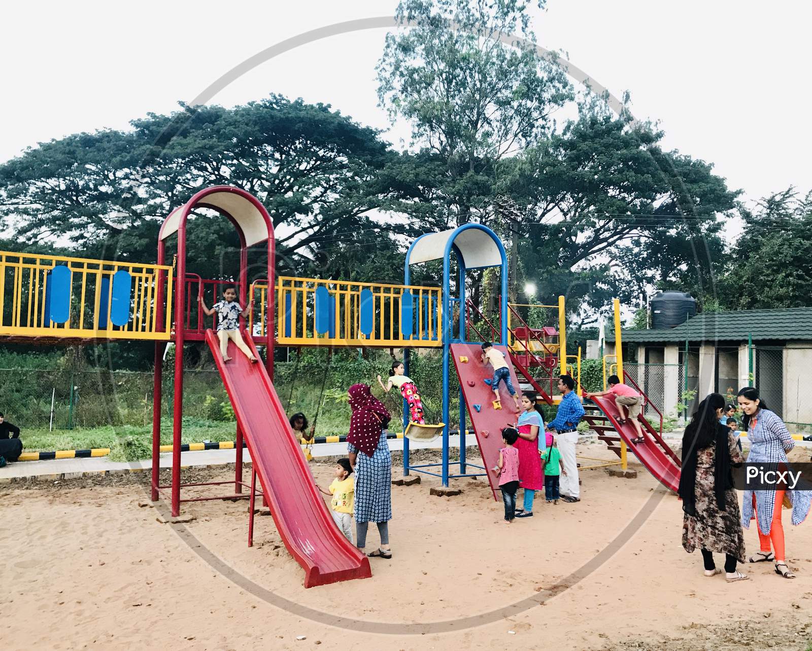 Children playing in a garden play area