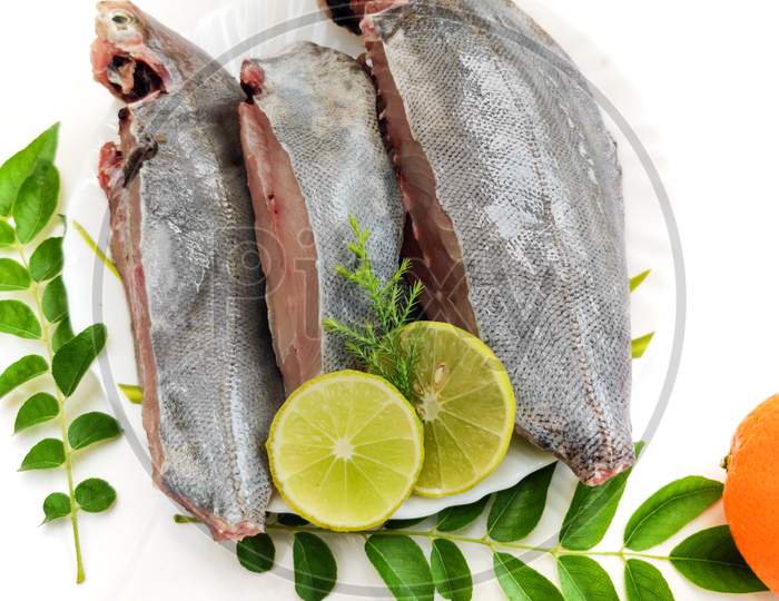 Fresh Ready To Cook Black Pomfret Fish Isolated On White Background.Selective Focus.