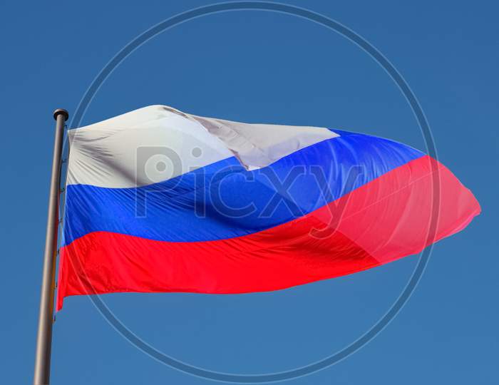 Russian Flag Of Russia Over Blue Sky