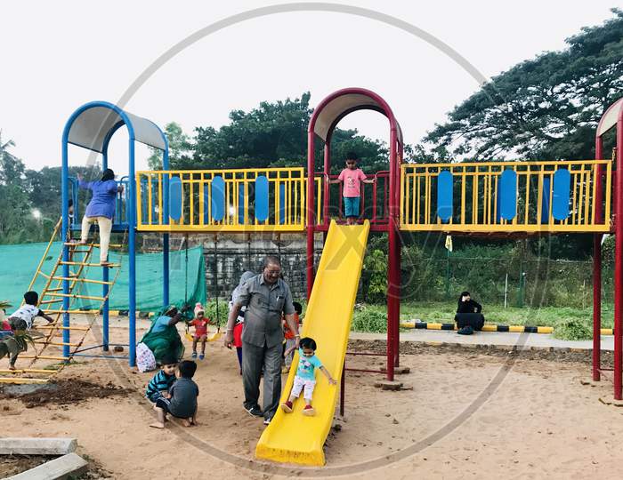 Children playing and enjoying on a slides