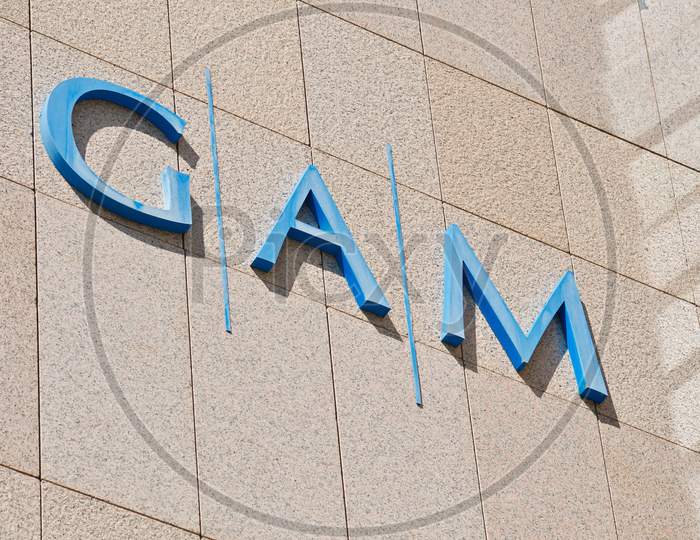 Gam Investments Company Sign On Office Building In Lugano, Switzerland