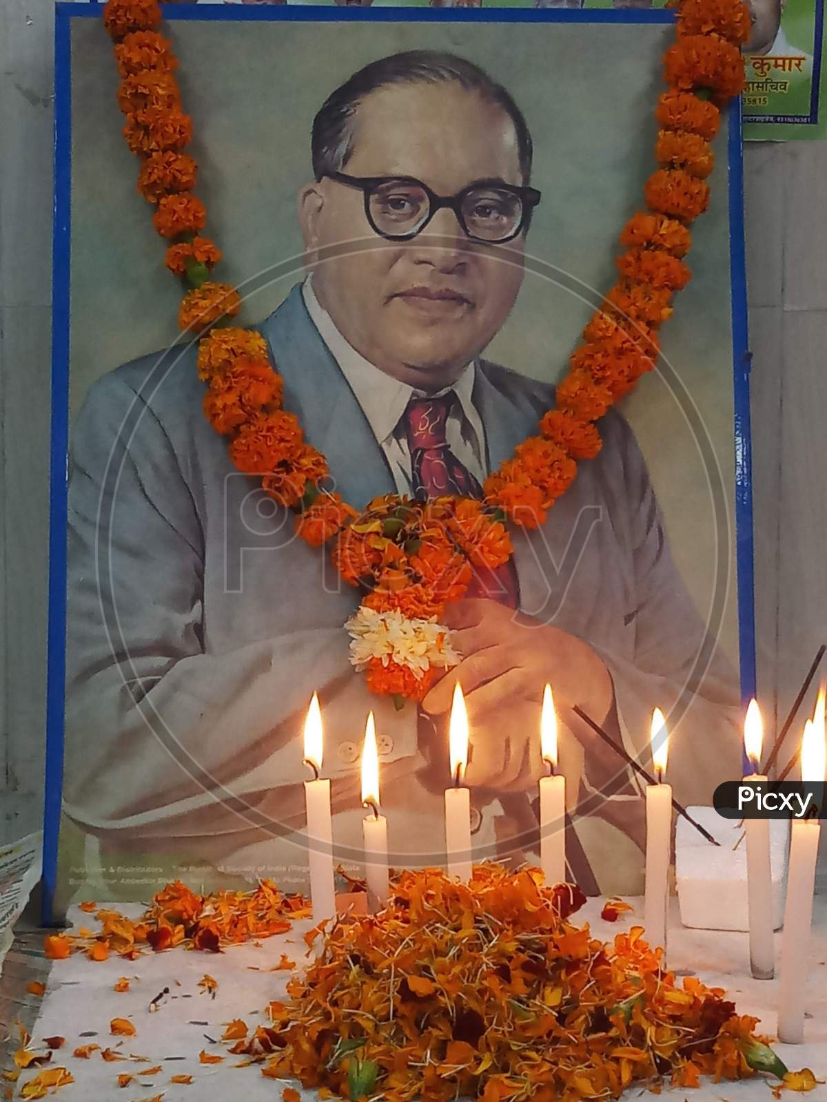 Dr.B.R Ambedkar photo frame with candles and garland on Ambedkar Jayanti Celebrations