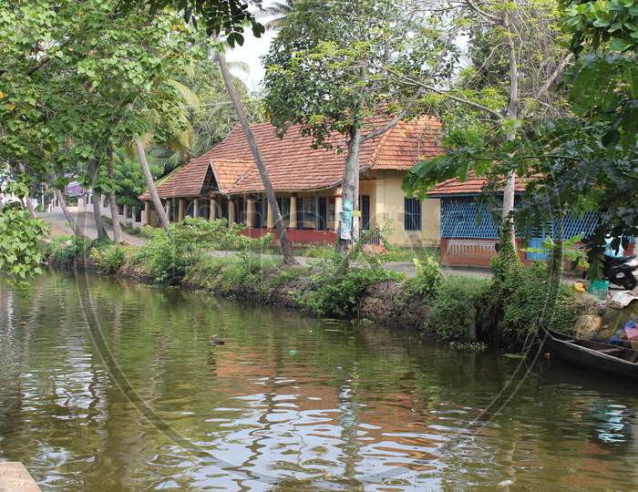 Classical view of traditional building at the canal side in Kumarakom, Kerala, India